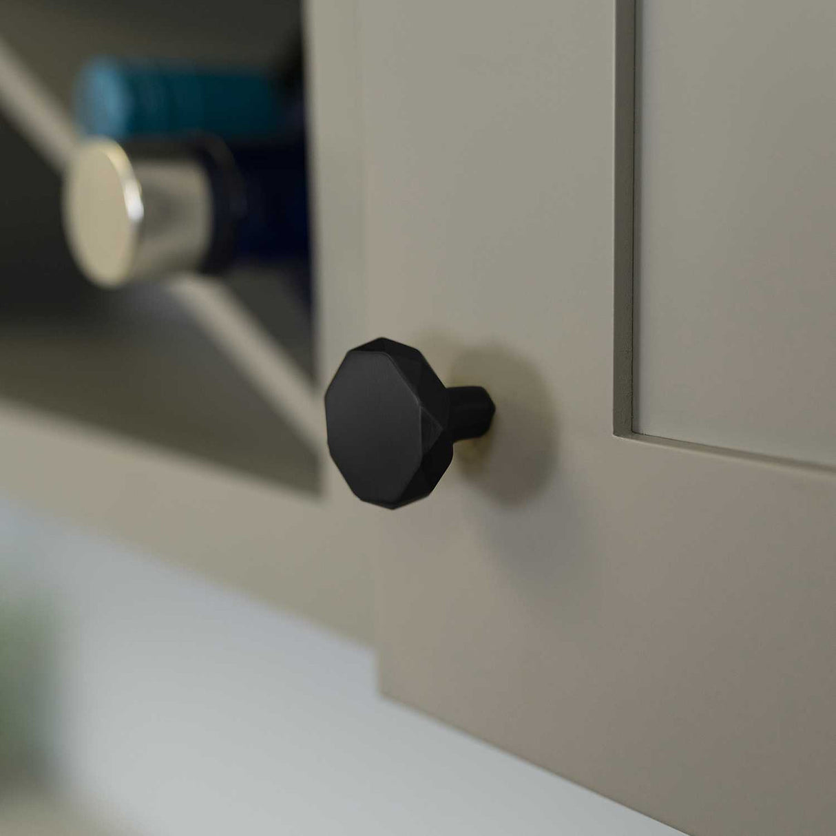 Cabinet View of a Matte Black 1-1/4" Geometric Cabinet Knob from Hickory Hardware's Karat Collection H077839-MB