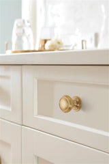 AMEROCK Revitalize 1-1/4" Diameter Cabinet Knob in Golden Champagne BP55342BBZ on Off White
