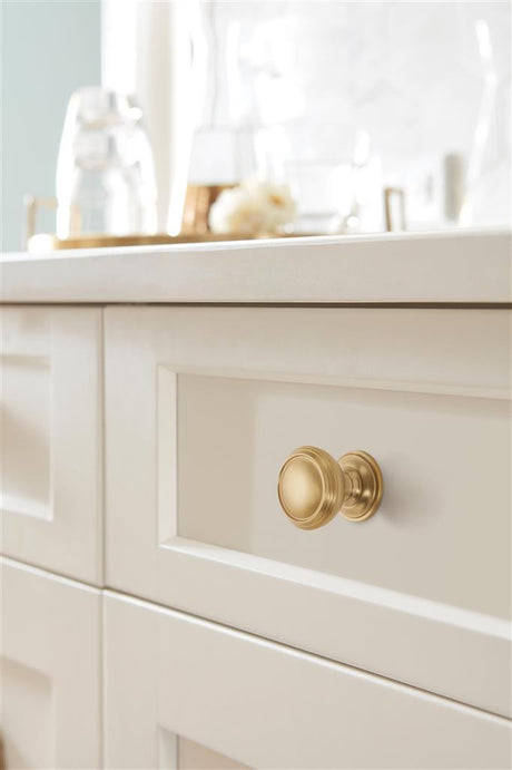 AMEROCK Revitalize 1-1/4" Diameter Cabinet Knob in Golden Champagne BP55342BBZ on Off White
