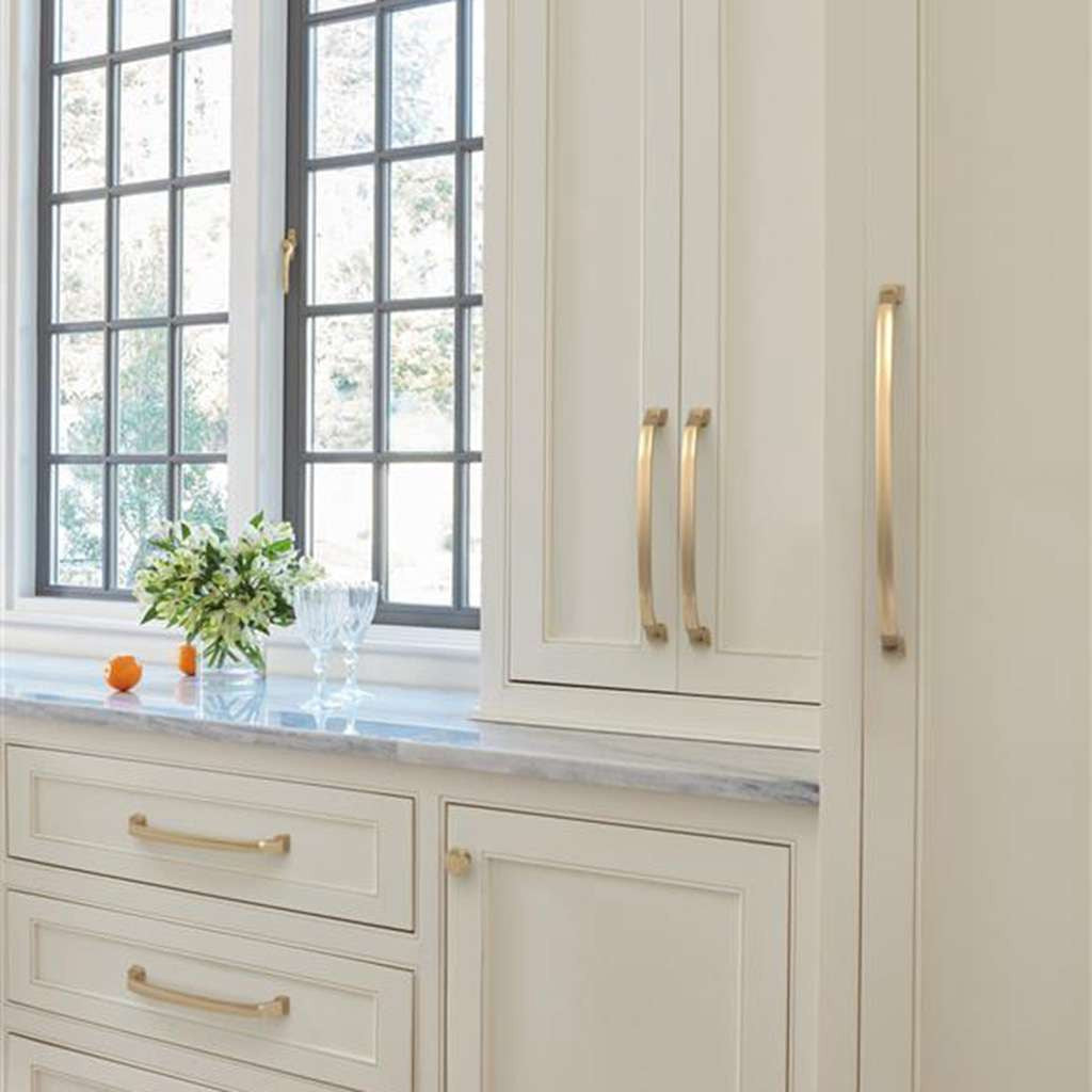 AMEROCK Revitalize Appliance Pulls in Champagne Bronze on White Kitchen