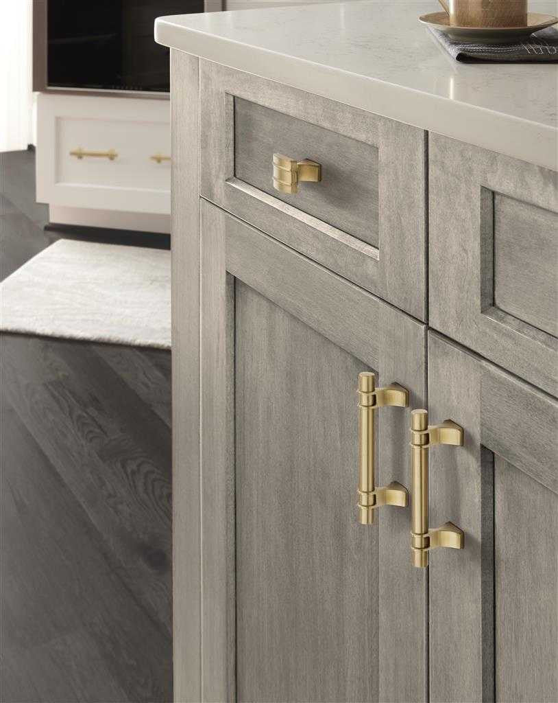 Amerock's Davenport Collection in Champagne Bronze on Gray Wood
