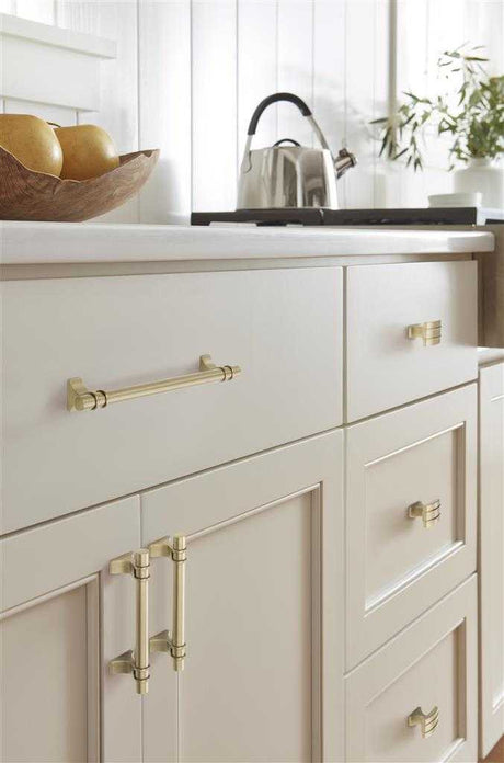 Amerock's Davenport Collection in Golden Champagne on White