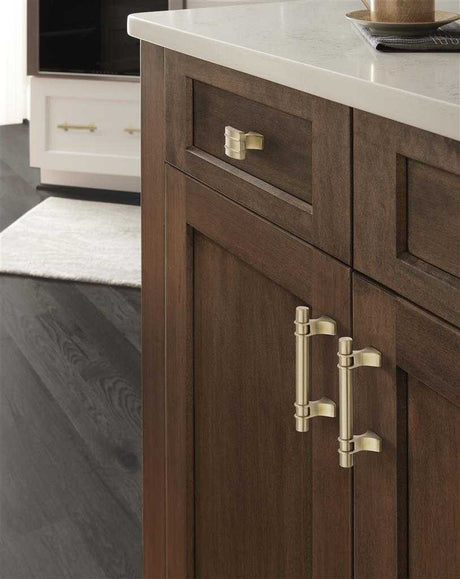 Amerock's Davenport Collection in Golden Champagne on Wood