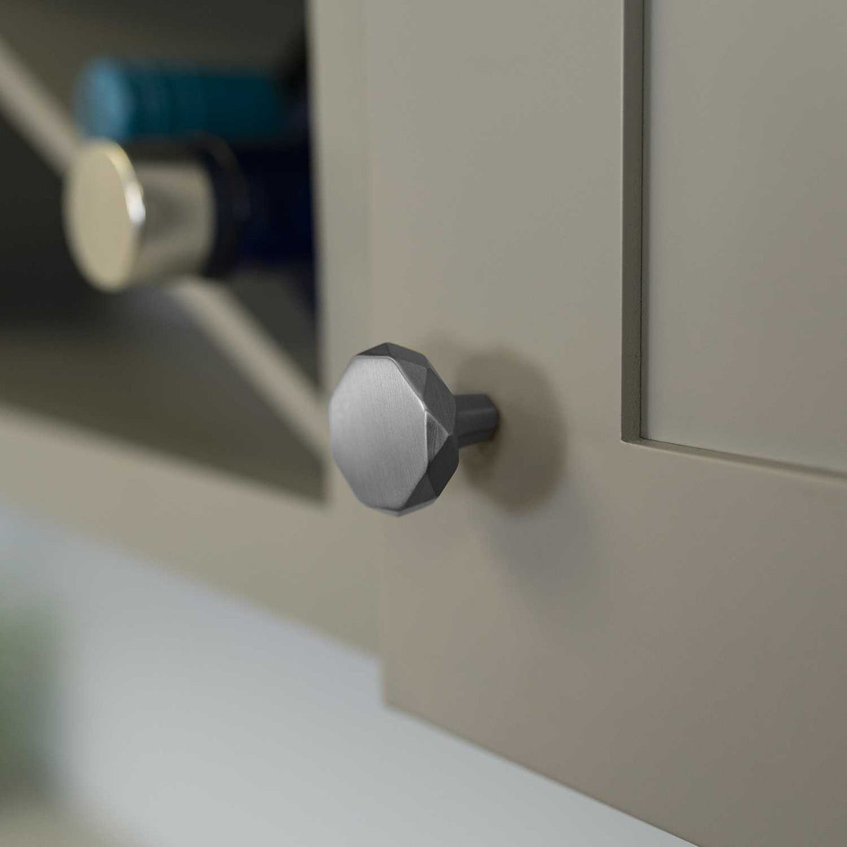 Cabinet Door View of a Satin Nickel 1-1/4" Geometric Cabinet Knob from Hickory Hardware's Karat Collection H077839-SN