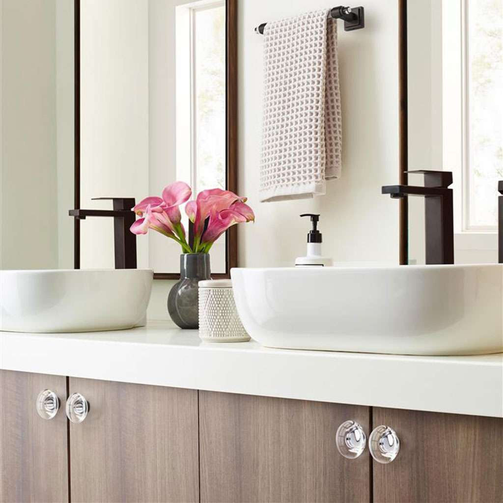 AMEROCK Glacio 1-3/4" Diameter Glass Cabinet Knob in Clear and Oil Rubbed Bronze BP36652CORB in Brown Bathroom