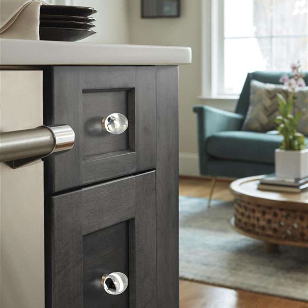 AMEROCK Glacio 1-3/4" Length Glass Oval Cabinet Knob in Clear and Champagne Bronze BP36651CCZ on Dark Gray