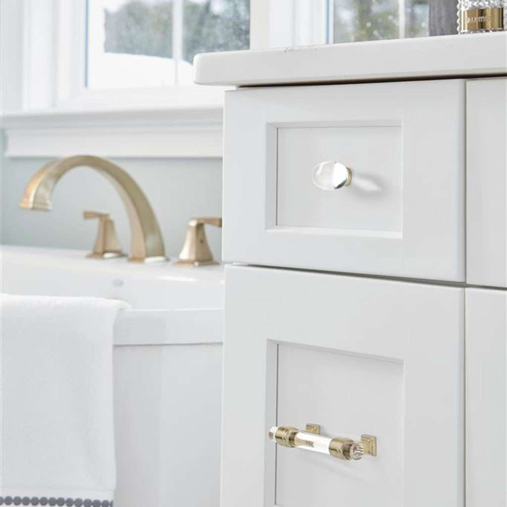 AMEROCK Glacio 1-3/4" Length Glass Oval Cabinet Knob in Clear and Golden Champagne BP36651CBBZ on White