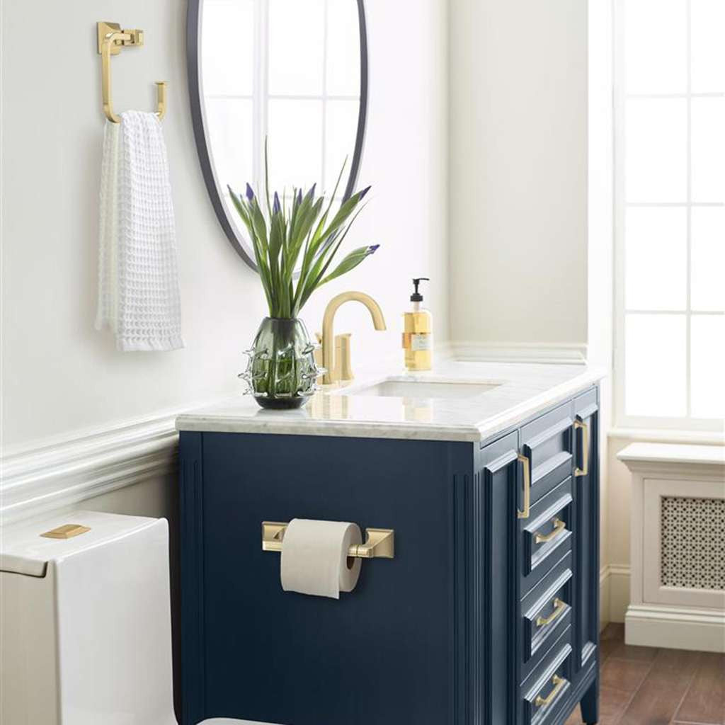 AMEROCK Mulholland Pivoting Toilet Paper Holder in Golden Champagne BH36021BBZ on Blue