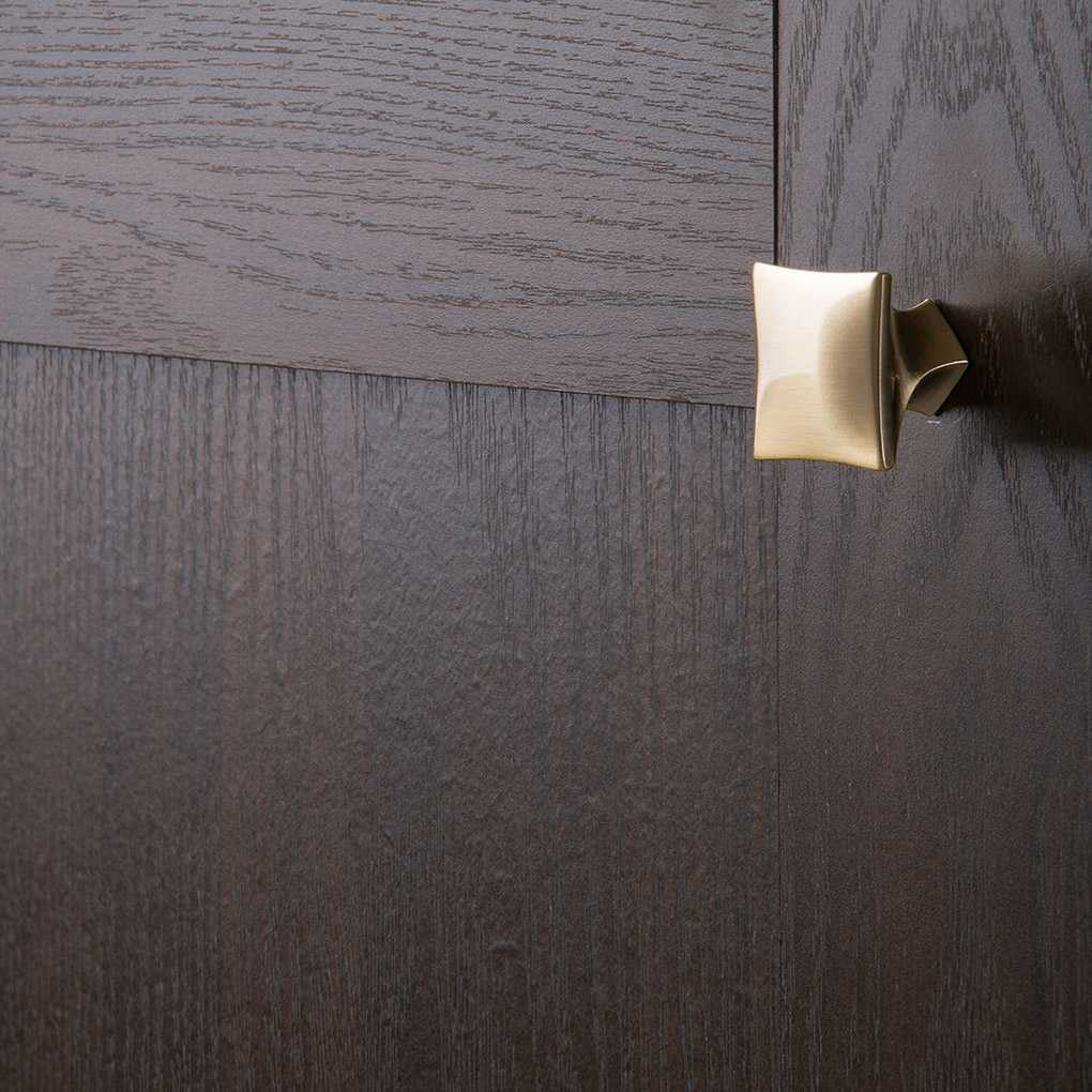 Cupboard View of a Elusive Golden Nickel Square Cabinet Knob from Hickory Hardware's Twist Collection H076014-EGN