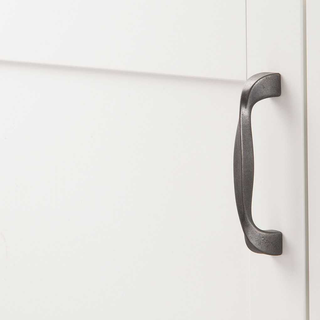 Cupboard View of a Black Iron 3-3/4" Hole Centers Cabinet Handle Pull from Hickory Hardware's Twist Collection H076016-BI